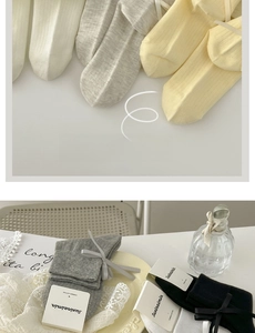 Detailed texture of combed cotton ribbed socks with elegant ribbon bow decoration