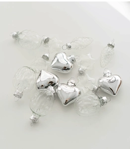 Assorted clear and silver glass Christmas ornaments in heart and pinecone shapes