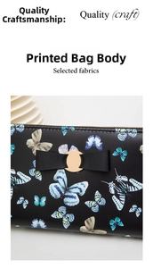Detail of elegant butterfly print on black PU leather wallet with a golden metal buckle
