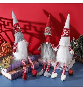 Detailed view of three festive Nordic Christmas gnomes with long striped legs and plush beards