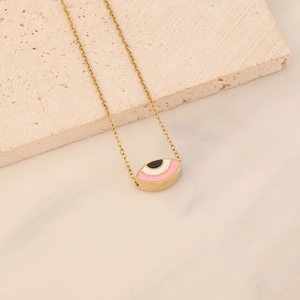 Gold chain necklace with evil eye pendant in pink white and black enamel detail