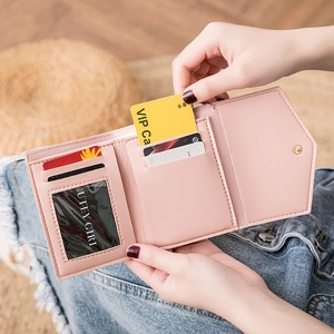 Pink faux leather tri-fold short wallet for women featuring multiple card slots and snap button