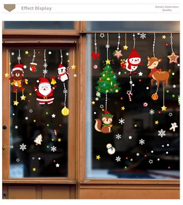 Detailed view of Christmas window stickers featuring Santa, reindeer and snowman on glass