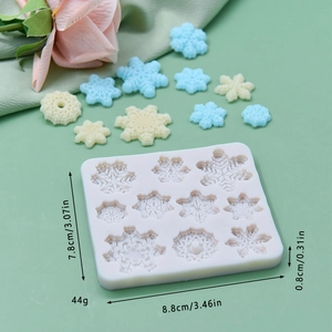 White snowflake silicone mold with ten cavities for DIY cake baking and fondant crafts