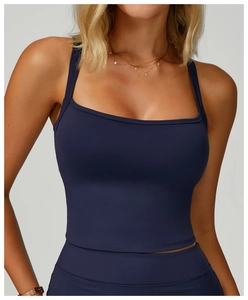 Close-up of navy blue double-strap yoga vest featuring a square neck and slim fit design