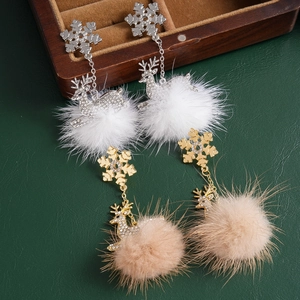 Christmas earrings with snowflake, rhinestone reindeer and plush fur balls on wooden box