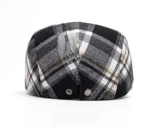 Rear view of plaid ivy cap featuring vintage pattern and silver metal snap buttons