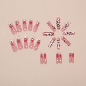 Pink and red gradient press-on nails with sun and moon art in long coffin shape
