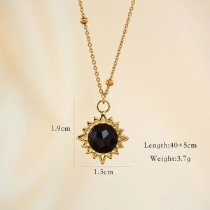 Detailed view of sun pendant with black faceted stone including product dimensions