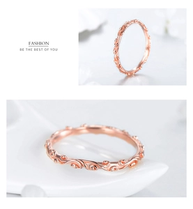 Close-up of vintage engraved vine pattern on slim rose gold 925 silver ring band
