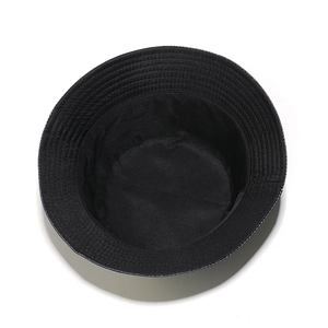 Detailed top view of black bucket hat lining with reinforced multi-row parallel stitching