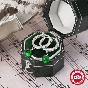Elegant S925 sterling silver hoop earrings with emerald green gemstones on velvet box