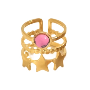 Detail of multi-layer 18K gold ring with pink natural stone and star cutout pattern