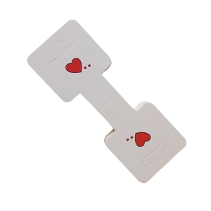 White folding jewelry card with red heart patterns for earring or hair tie display