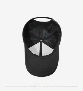 Detail view of black men's baseball cap interior with mesh lining and adjustable buckle