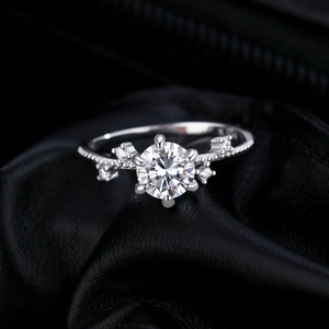 Classic six-prong 1-carat moissanite ring with floral side stones in silver