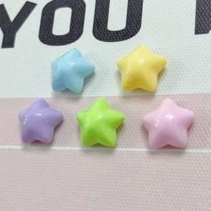 Detailed view of five colorful star-shaped resin charms in macaron pastel colors