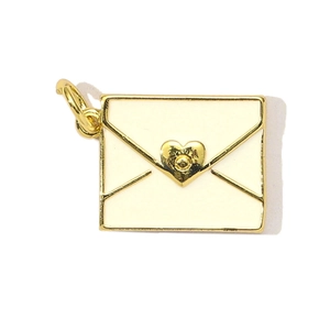 Detailed view of an off-white envelope pendant with gold heart seal and metal ring