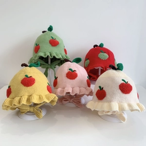 Cute apple-themed knitted baby beanies with ruffles and chin straps in various colors