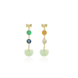 Detail view of gold bow earrings with green jade drops and Chinese character charms
