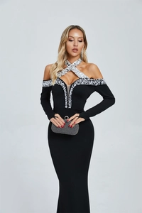 Detail of dark style black fisheye dress with halter neck, sequins and white pearls