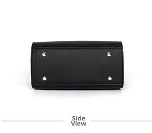Detailed base view of black leather handbag with four protective gold metal feet studs