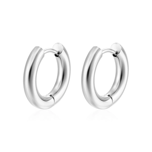 Detailed view of polished silver stainless steel hoop earrings on a white background