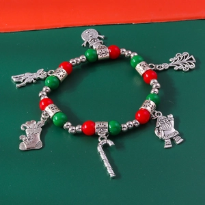 Detail of Christmas beaded bracelet with Santa Snowman Reindeer and Xmas tree alloy charms