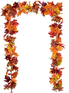 Detail of artificial autumn maple leaf garland with red and orange foliage on white background