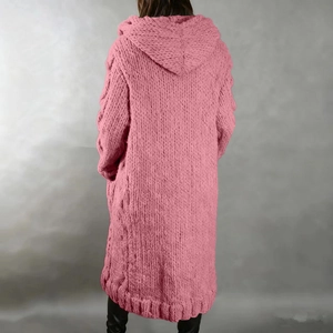 Women's pink oversized chunky knit hooded cardigan sweater with cable stitch pattern