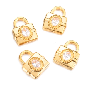 Vintage gold lock pendants with zircon stones for DIY jewelry making on white background