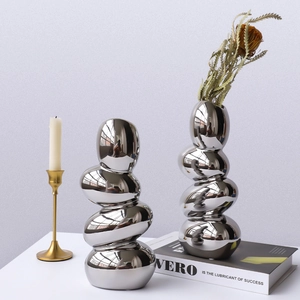 Modern silver mirror electroplated pebble vases in creative stacked stone design