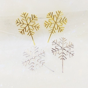 Golden and silver snowflake cake toppers set for festive Christmas dessert decoration