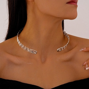 Detailed view of silver braided choker on model highlighting metal texture and open design