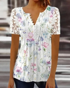 Close-up of V-neck white floral top with lace hollow sleeves and decorative buttons