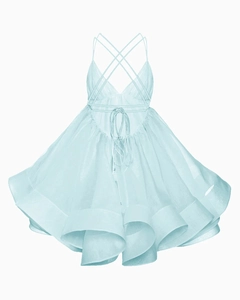 Detail of light blue pleated organza dress showing backless cross straps and layered hem