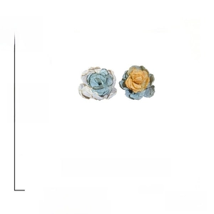 Detail showing asymmetrical flower stud earrings in blue and orange fabric with 925 silver needles