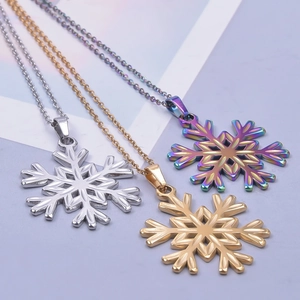 Detailed view of snowflake pendants in gold, silver, and rainbow finishes with O-chains
