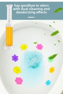 Detail view of colorful floral toilet cleaning gel stamps applied inside the bowl
