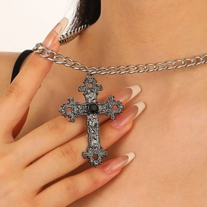 Gothic vintage silver cross necklace with black gemstone and ornate relief details
