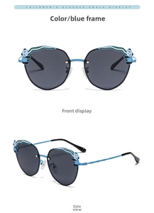 Detail view of blue polarized kids sunglasses with panda decor and metal bridge