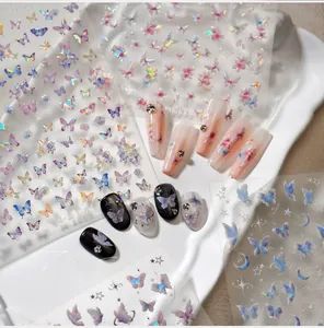 Macro shot of iridescent butterfly nail stickers with holographic effect on tips