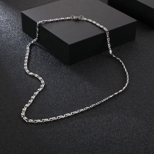 Close-up of a silver stainless steel square pearl chain with a lobster clasp closure
