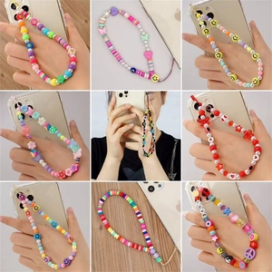 Handmade colorful beaded phone straps with clay smiley faces and assorted charms