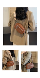 Makro-Detail der braunen Leder-Brusttasche mit dreifachen Reißverschlussfächern
