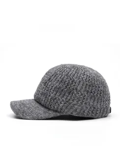 Side view of gray cable knit baseball cap showing warm textured rabbit wool fabric