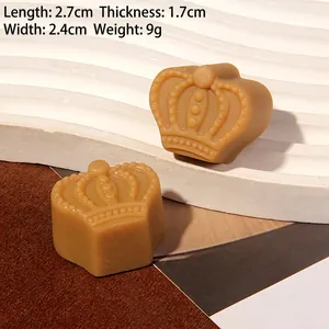 Miniature resin chocolate crown charm measuring 2.7cm by 2.4cm for DIY craft projects