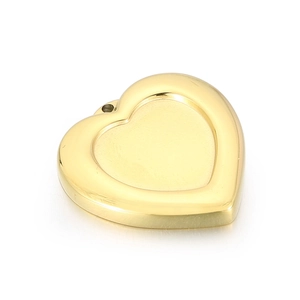Detailed view of heart-shaped gold stainless steel pendant with textured dotted edges