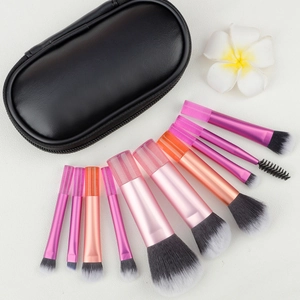 Detailed close-up of 8-piece portable makeup brush set with pink metal handles and pouch