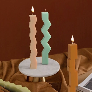 Artistic wavy and geometric candle set with decorative silicone mold pillars on a tray